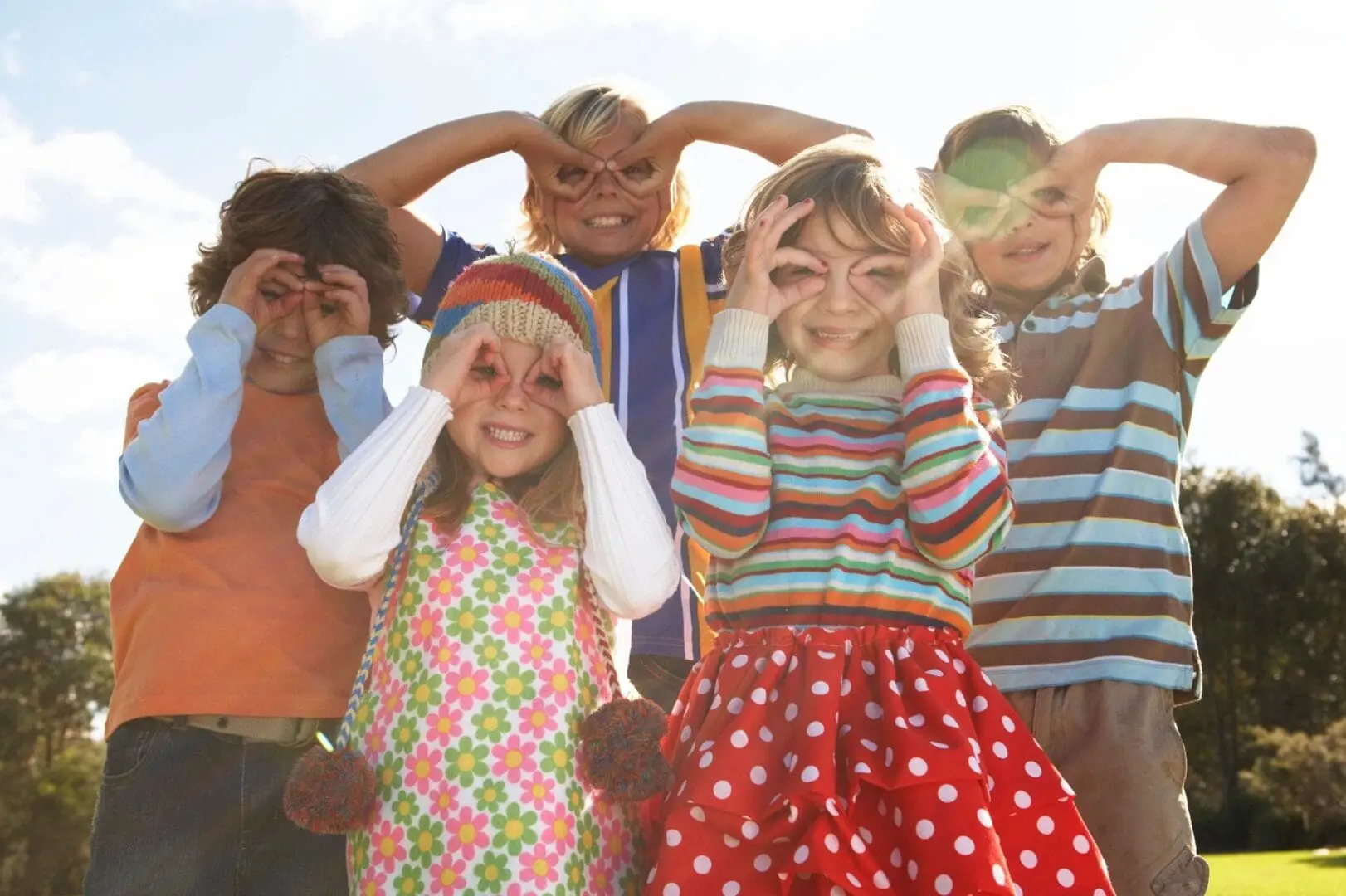 A group of children standing next to each other.