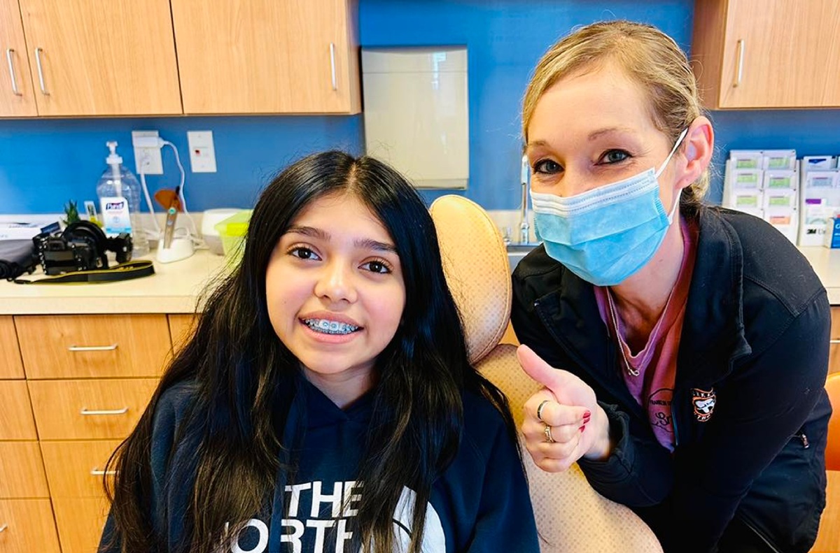 Franklin Orthodontics team member with a smiling patient in Chambersburg, PA